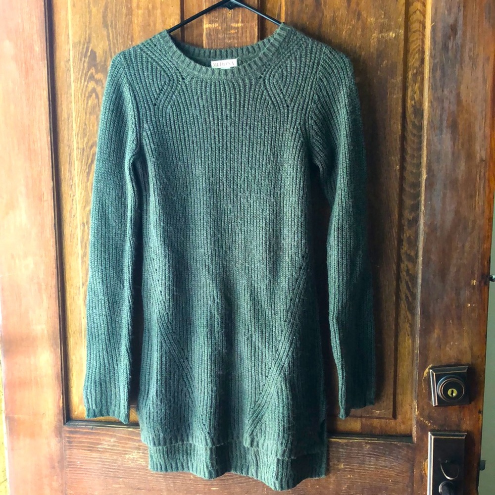 Long green knit sweater with somewhat open weave